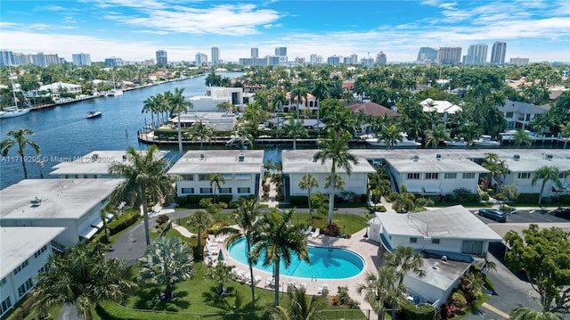 drone / aerial view with a city view and a water view