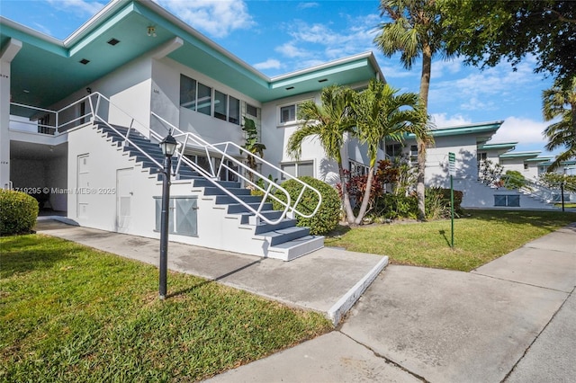 view of property featuring stairs