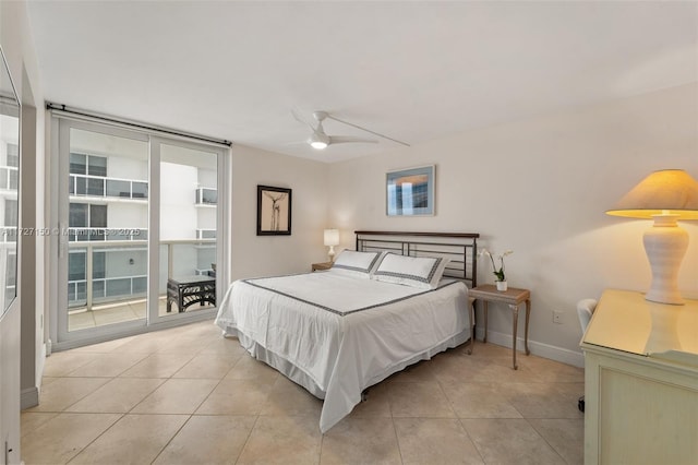 tiled bedroom featuring ceiling fan, floor to ceiling windows, and access to outside