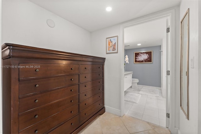 corridor featuring light tile patterned floors