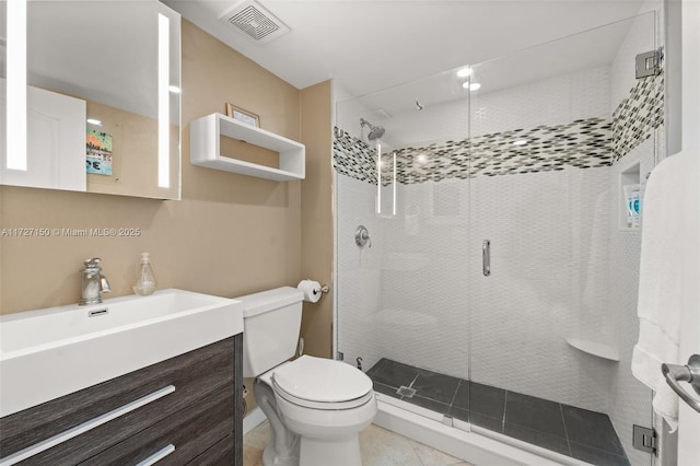 bathroom with toilet, tile patterned flooring, an enclosed shower, and vanity