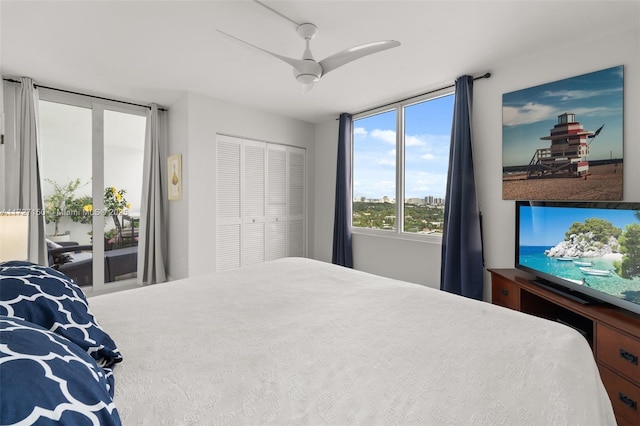 bedroom with ceiling fan, a closet, and access to outside