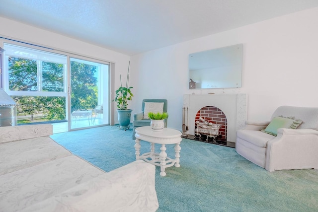 sitting room featuring a fireplace and carpet floors