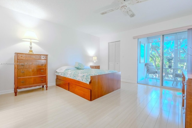 bedroom featuring access to exterior and light hardwood / wood-style floors