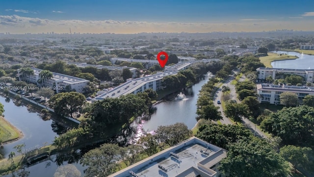 birds eye view of property featuring a water view