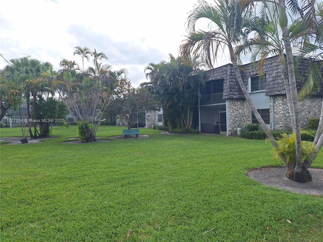 view of community with a yard