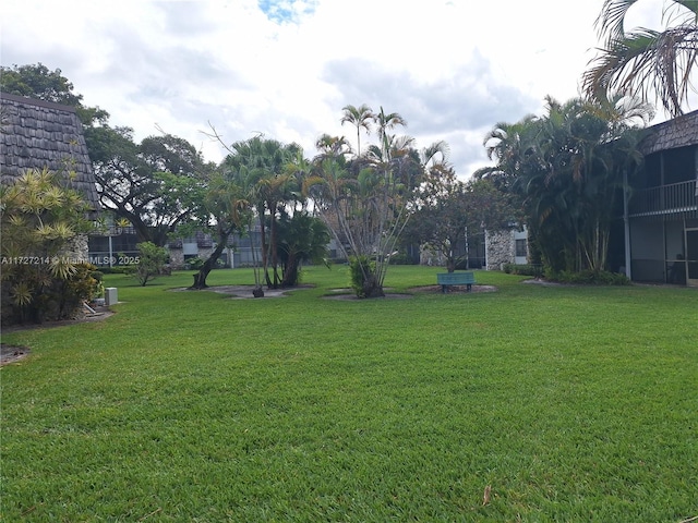 view of home's community featuring a yard