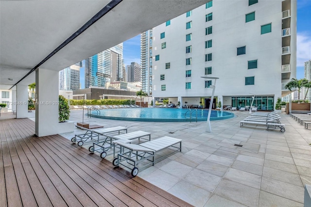 view of pool featuring a patio area