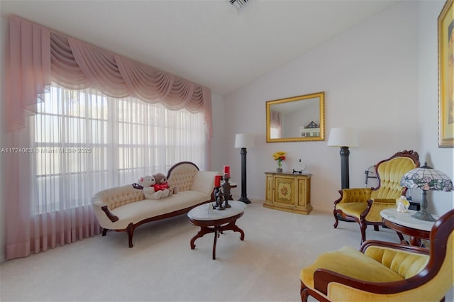 sitting room with light carpet and lofted ceiling