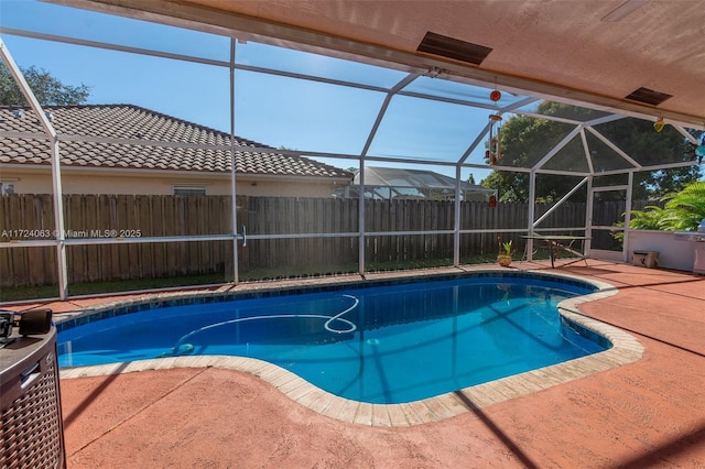 view of pool featuring a lanai and a patio area