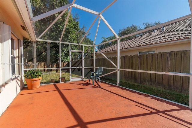 view of patio with glass enclosure