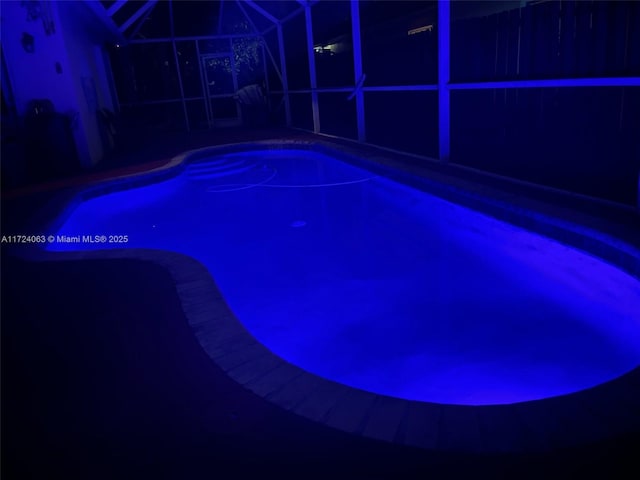 view of pool at night