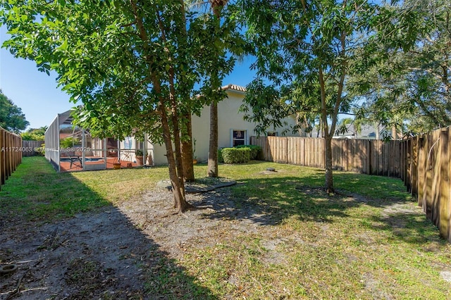 view of yard with a lanai