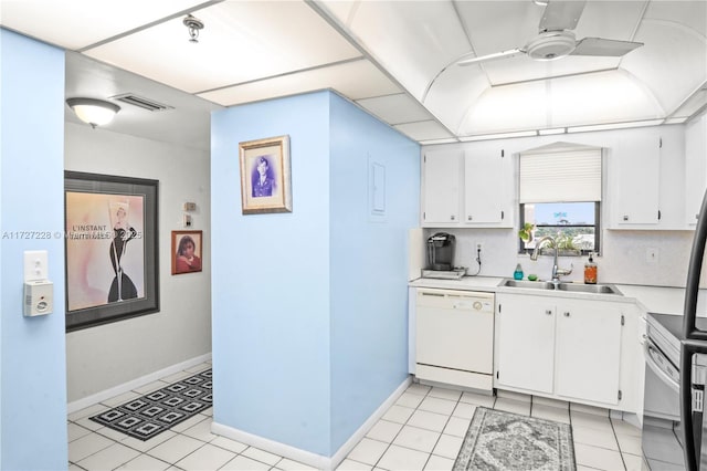 kitchen with white cabinets, dishwasher, tasteful backsplash, sink, and range with electric stovetop