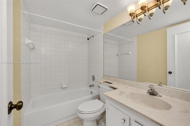 full bathroom with toilet, vanity, tiled shower / bath, and tile patterned flooring