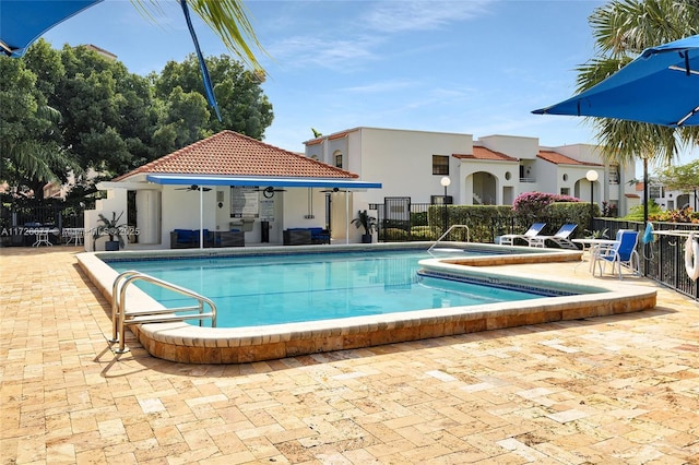 view of swimming pool with a patio area