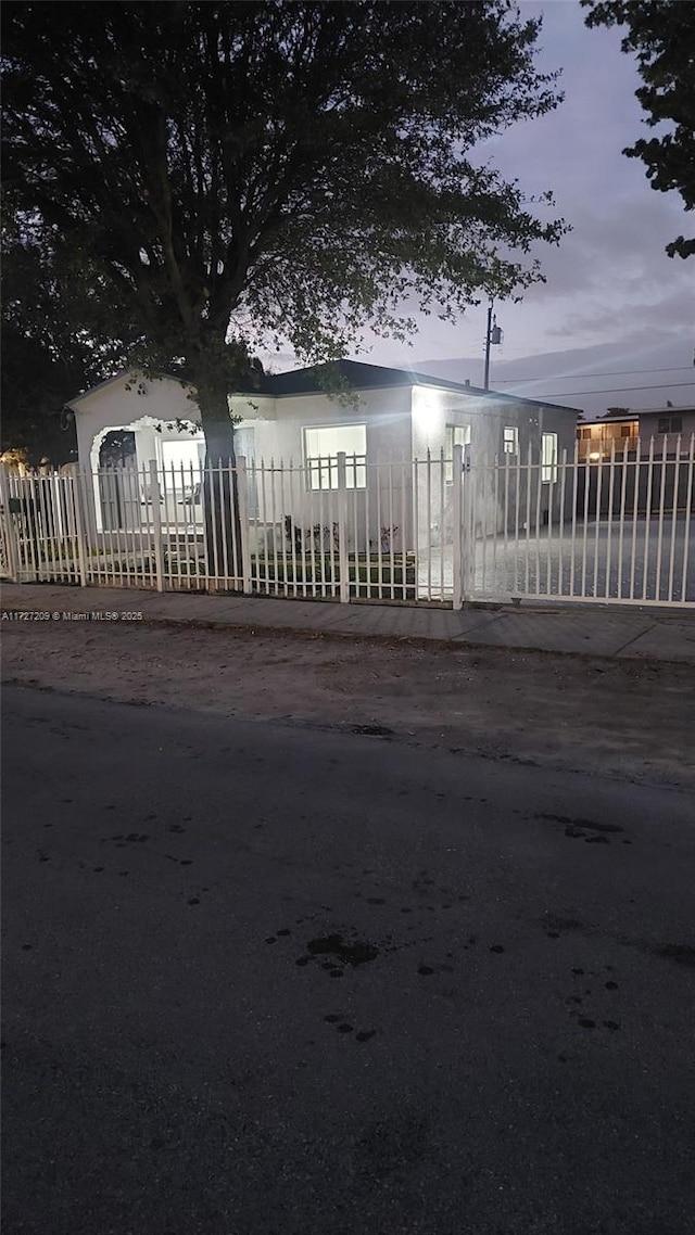 view of gate at dusk