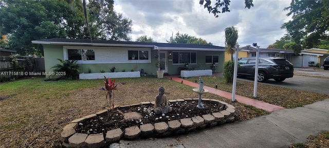 ranch-style house with a front yard