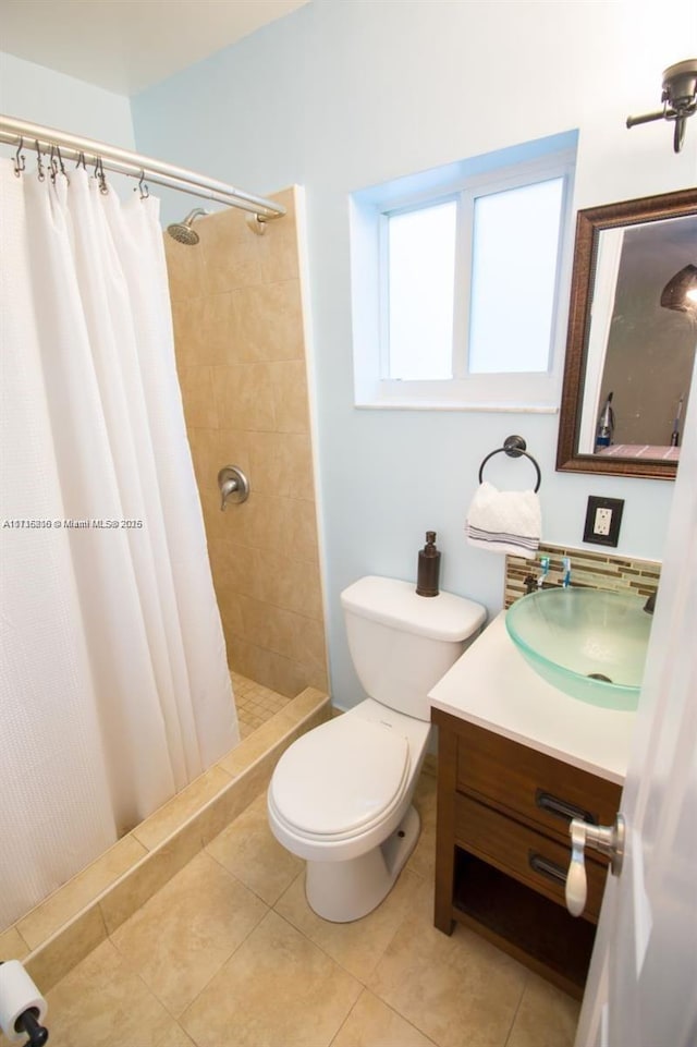 bathroom with tile patterned flooring, toilet, walk in shower, and vanity