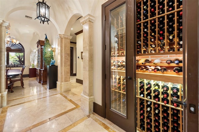 wine cellar featuring a notable chandelier