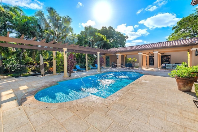 view of swimming pool featuring pool water feature, a pergola, and a patio