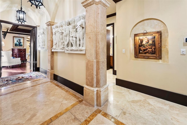 hallway featuring ornate columns