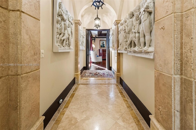 hallway featuring vaulted ceiling