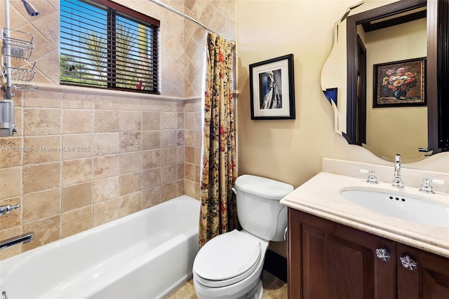 full bathroom featuring toilet, vanity, and shower / bath combo with shower curtain