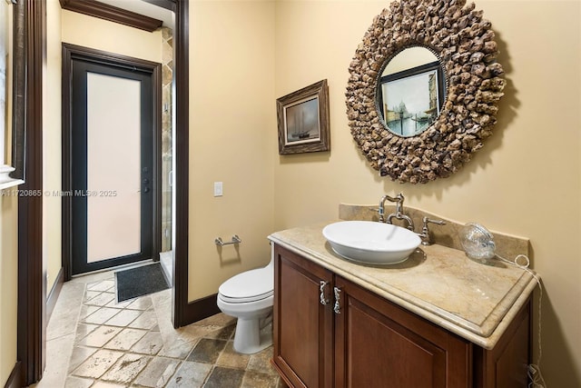 bathroom featuring toilet and vanity