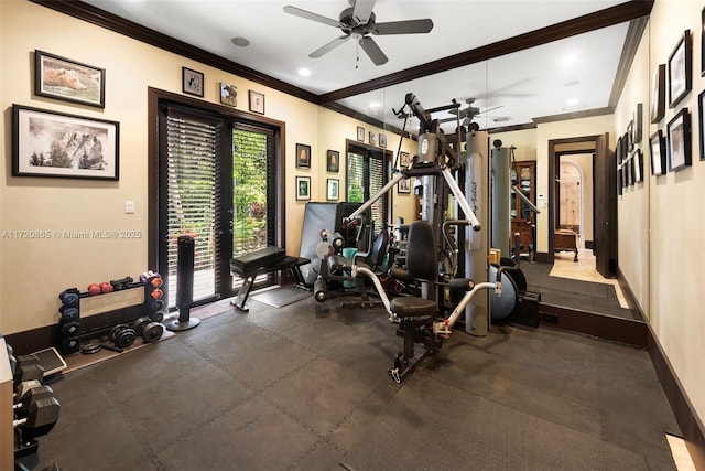 exercise room featuring ceiling fan and ornamental molding