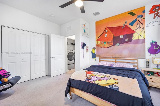 bedroom featuring washer / clothes dryer, carpet floors, a closet, and ceiling fan