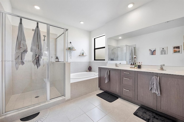 bathroom featuring vanity, separate shower and tub, and tile patterned flooring