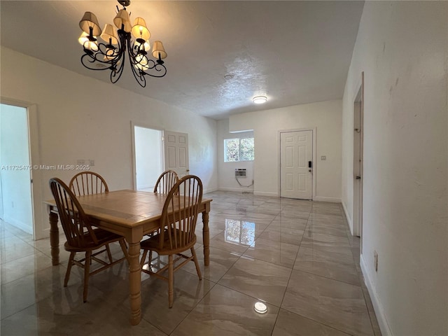 dining space with a wall mounted air conditioner, a textured ceiling, baseboards, marble finish floor, and a notable chandelier