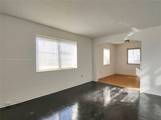 empty room featuring dark hardwood / wood-style flooring