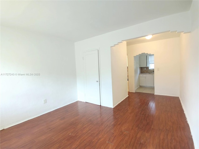 spare room featuring hardwood / wood-style flooring