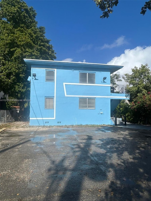 view of side of property featuring a balcony