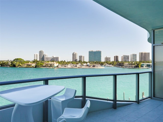 1135 103rd St Unit 502, Bay Harbor Islands, FL 33154 - balcony featuring a water view and a skyline view