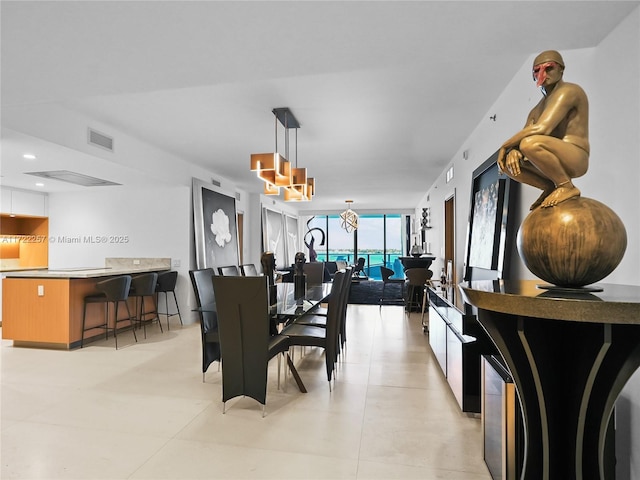 1135 103rd St Unit 502, Bay Harbor Islands, FL 33154 - dining room featuring a wall of windows