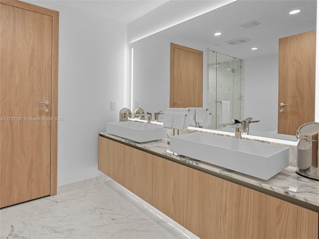 1135 103rd St Unit 502, Bay Harbor Islands, FL 33154 - bathroom with marble finish flooring, a marble finish shower, recessed lighting, and double vanity