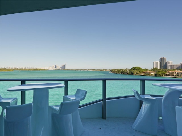 balcony featuring a water view