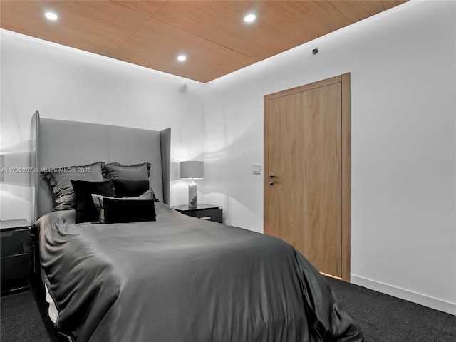 bedroom featuring carpet floors and wood ceiling