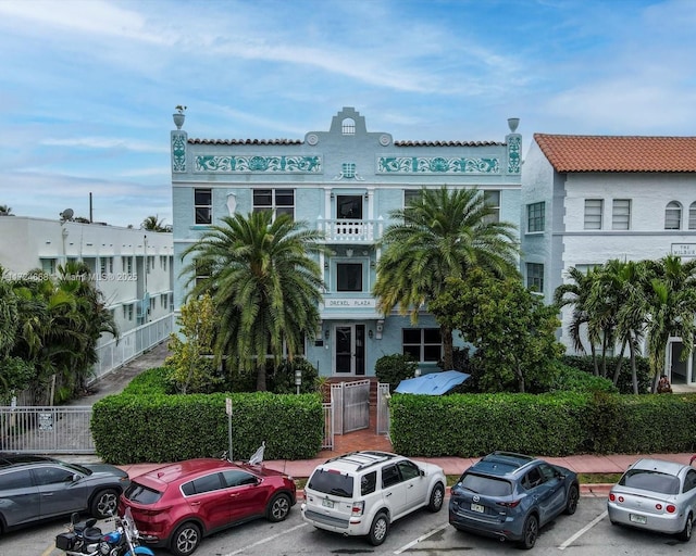 view of property with uncovered parking