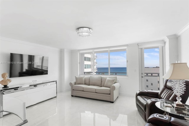 living room with light tile patterned floors, an inviting chandelier, ornamental molding, and a water view