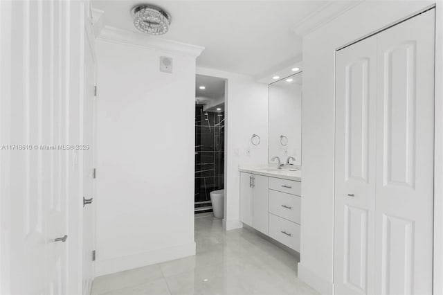 bathroom featuring toilet, crown molding, tile patterned floors, and vanity