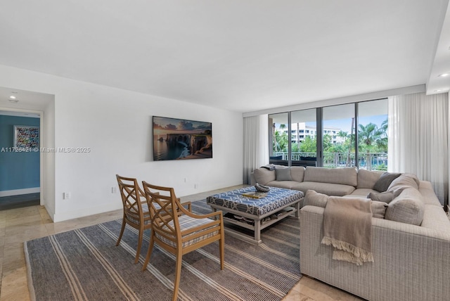 living room with floor to ceiling windows