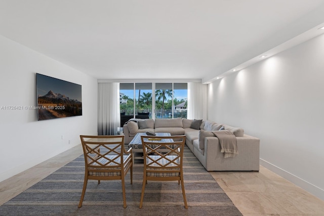 living room featuring a wall of windows