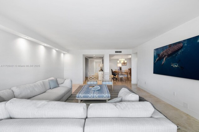 living room with a notable chandelier