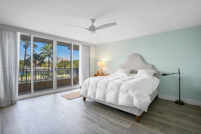 bedroom with ceiling fan, access to exterior, and dark wood-type flooring