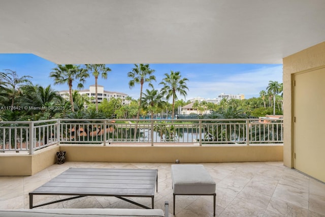 balcony featuring a water view