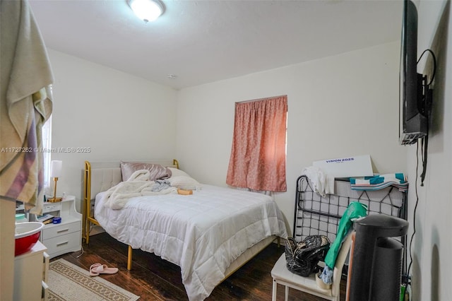 bedroom featuring dark hardwood / wood-style floors